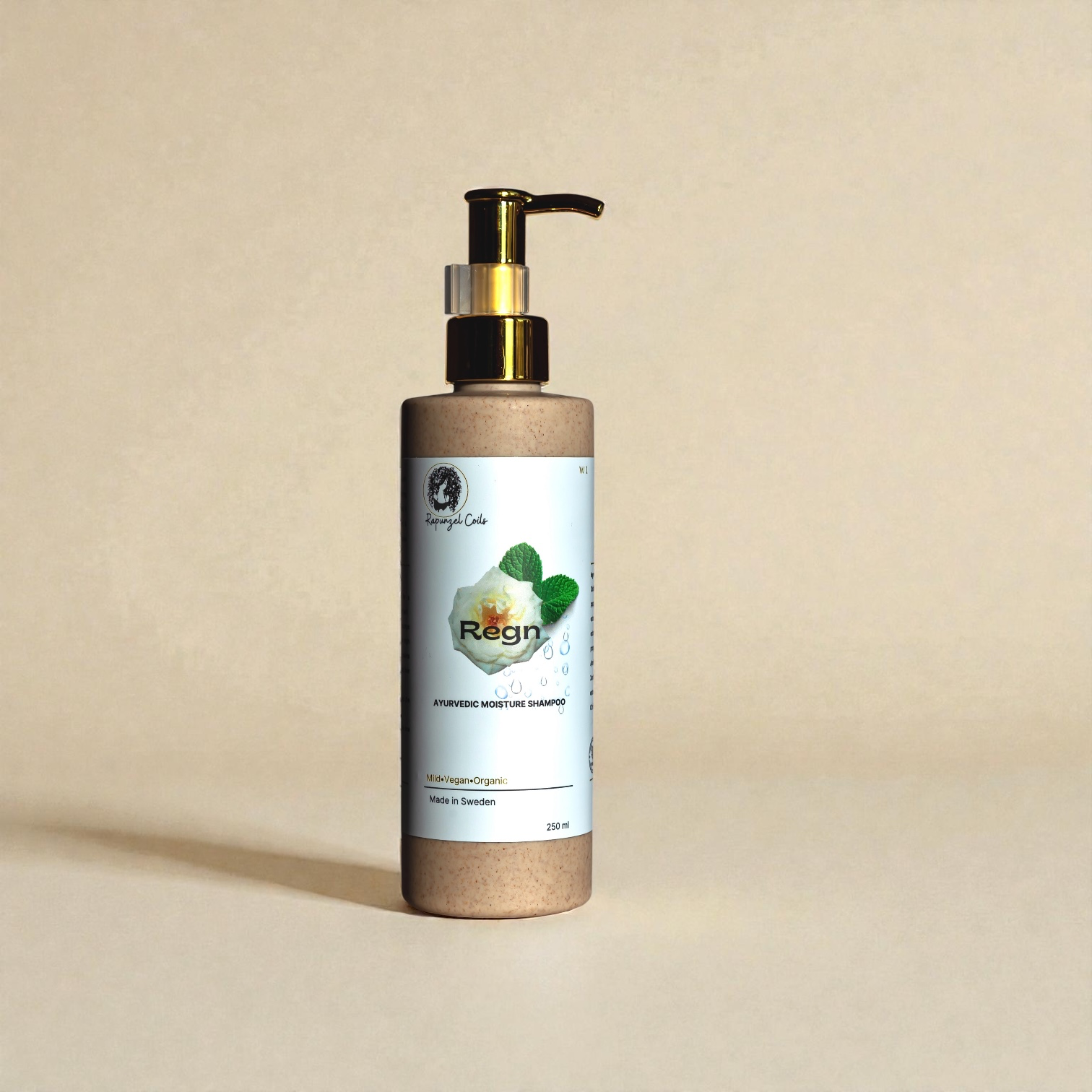 Regn Moisture Shampoo by Rapunzel Coils, designed to cleanse and hydrate dry, curly and textured hair without stripping moisture.